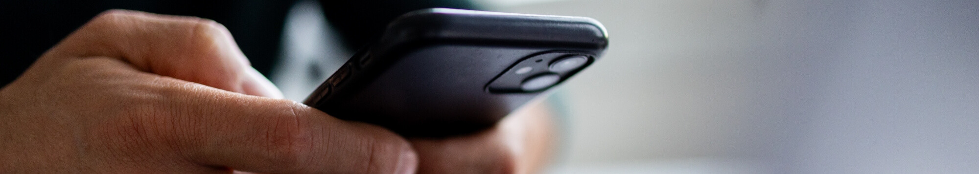 Close-up of a hand using a smartphone